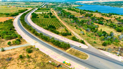 Aerial view of highway in the desert, Mui Ne, Vietnam. This is considered the most beautiful road across the desert from Mui Ne to Phan Ri along the central coast of Vietnam.