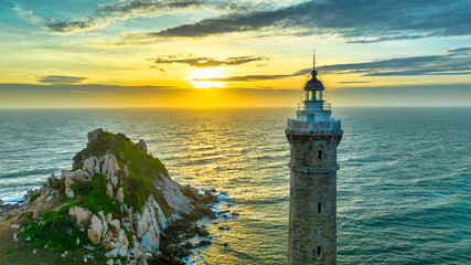 Ke Ga lighthouse is located on an island near the shore seen from above, this is an ancient...