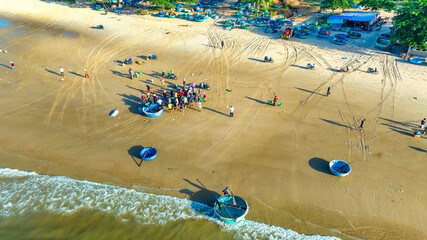 Mui Ne fish market seen from above, the morning market in a coastal fishing village to buy and sell seafood for the central provinces of Vietnam