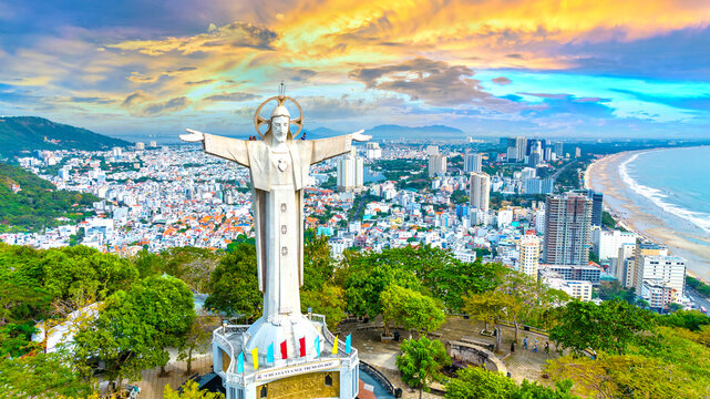 Aerial view of coastal Vung Tau city, Vietnam in the morning. The place where there is a statue of Christ on the mountain protects Vung Tau Peninsula's peace.