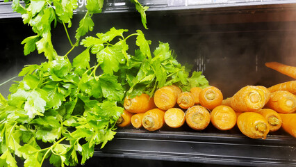 Greens on a produce wet wall with mist spraying down produce