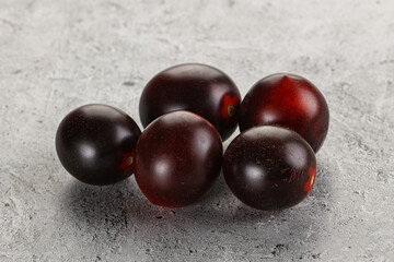 Raw ripe black kumato tomato