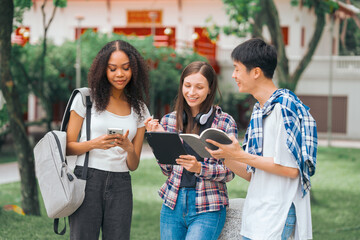 Group of young interracial diverse university students chatting together outside, engaging in a discussion together, college campus, enjoying campus recreation. Happy friends