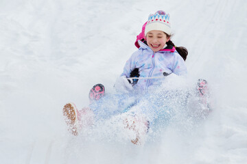 Winter entertainment on sledding. Time with friends.