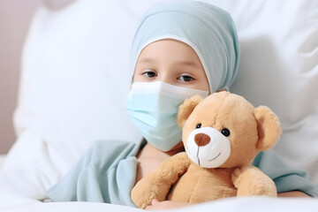 Naklejka premium Cancer child patient under chemotherapy and teddy bear on the bed
