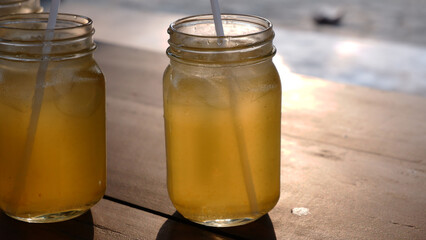 Aesthetic photo of a fruit juice drink in the afternoon sun light