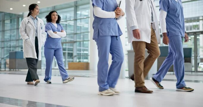 Doctor group, walking and healthcare conversation with planning in hospital of medical group. Nurses, employees and team in a clinic with discussion, communication and collaboration for nursing
