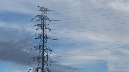 electricity transmission towers against a dramatic sky, symbolizing energy, connectivity, and technological progress
