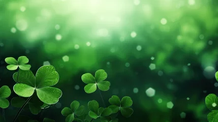 Poster Green clover leaves with bokeh effect. St. Patrick's Day background © tashechka