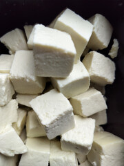 White fresh raw Dairy product Cheese or Paneer display close view.