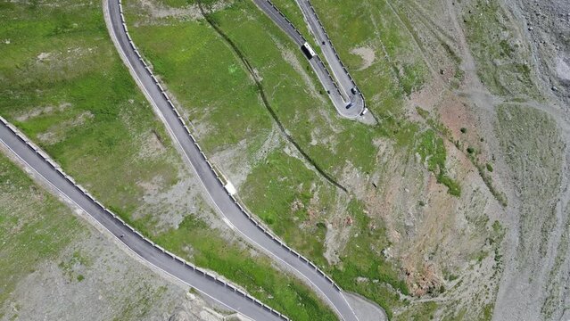 Flight with top down view of Stelvio Pass serpentine road in Italy