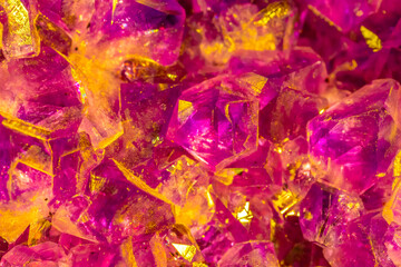 Multi-colored crystal mineral stone. Gems. Mineral crystals in the natural environment. Texture of precious and semiprecious stones. shiny surface of precious stone