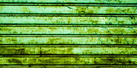 Zelfklevend Fotobehang Oude deur background green old weathered aged steel door roller shutter metal texture iron rusty