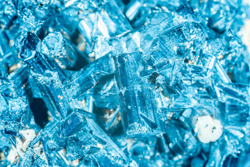 Blue Crystal Mineral Stone. Gems. Mineral crystals in the natural environment. Texture of precious and semiprecious stones. Seamless background with copy space colored shiny surface of precious stones