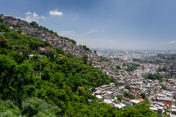 Poor residential housing in favela on rainforest hillside in Rio