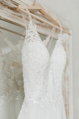 Elegant white lace and sequin embroidered wedding dress detail