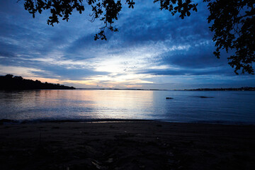 Quiet beach front overlooking ocean at dawn