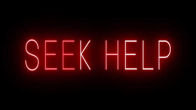 Flickering red retro style neon sign glowing against a black background for SEEK HELP