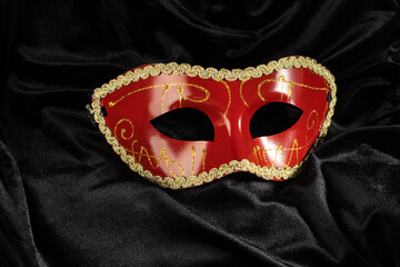 theatrical mask with fabric on a black background, opera and theater, performance on stage