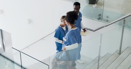 Talking, busy and doctors walking in hospital or stairs for clinic services, results or healthcare planning of documents. Research, report and nurse or professional medical people advice or strategy