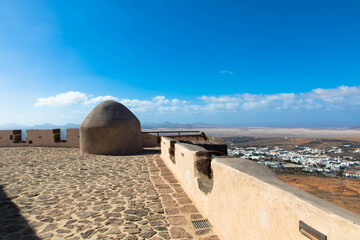 Detail view. The castle of Santa Barbara on the volcanic hilltop of Guanapay mountain.Teguise,...