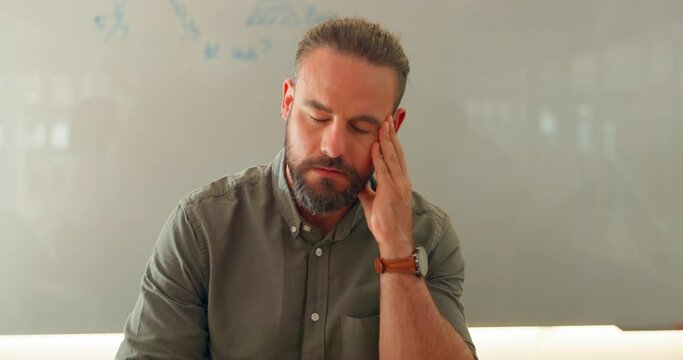 Anxiety, conference meeting and guilt of a business man in a office with team. Tired, staff paperwork stress and fatigue of working logistics employee feeling worry from company mistake in management