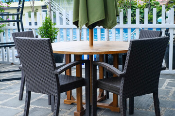 Poolside Relaxation: Captivating Combination of Table and Chairs