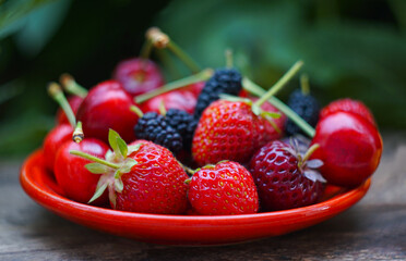 Cherries and other fruits on the board