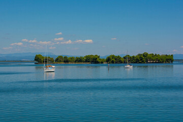 Shallow waters in the Grado section of the Marano and Grado Lagoon in Friuli-Venezia Giulia, north east Italy. August - obrazy, fototapety, plakaty
