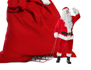 Santa Claus with big red bag full of Christmas presents on sled against white background