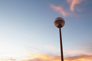 lamp post against blue sky