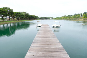 Fototapeta na wymiar View of the pond and wooden bridge.