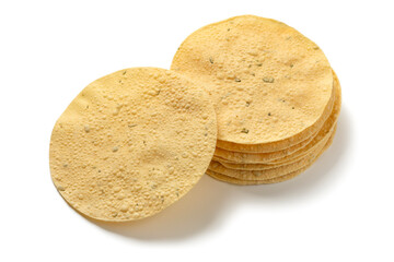 Heap of fresh baked papadams close up isolated on white background