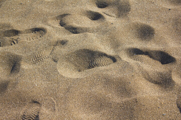 Fototapeta na wymiar These are shoe prints in the sand.