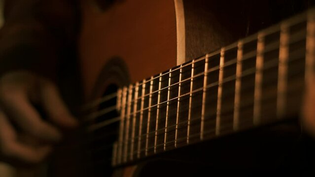 Cinematic dark key, close up professional classical guitar playing  close up teenager hands 4k