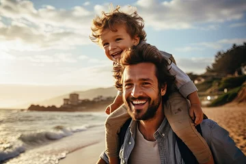 Fotobehang Happy dad holding happy little son on his shoulders. © BetterPhoto