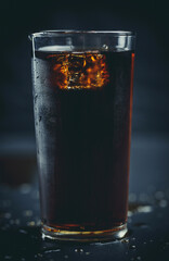 Soda pop with ice in a glass on a white background, delicious drink with ice, cola with ice - obrazy, fototapety, plakaty