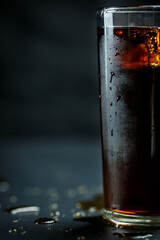 Soda pop with ice in a glass on a white background, delicious drink with ice, cola with ice