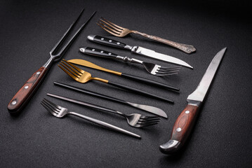 Kitchen knife and fork made of steel with copy space