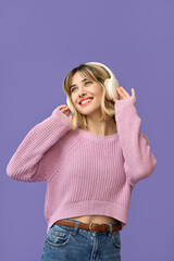 Happy funky gen z blonde young woman, cool smiling teenage girl wearing pink sweater and headphones...