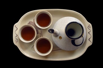 Tea set isolated on black
