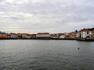 Naklejka premium View from the sea of the fishing village of Luanco. Asturias, Spain.
