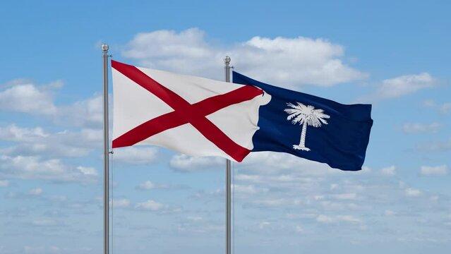 South Carolina and Alabama US state flags waving together on cloudy sky, endless seamless loop