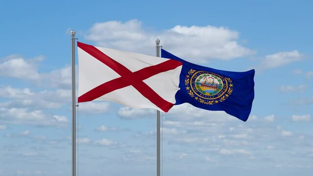 New Hampshire and Alabama US state flags waving together on cloudy sky, endless seamless loop