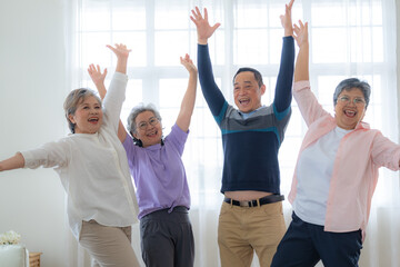 Group of Senior Retirement Friends Happiness Concept. Elderly people put hands together and cheer...