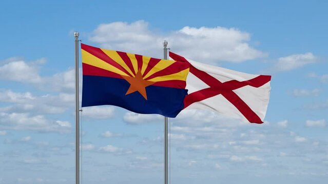 Alabama and Arizona US state flags waving together on cloudy sky, endless seamless loop