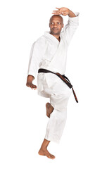 african american man in a gi traditional white karate uniform exercising for combat, isolated on white background
