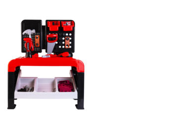 Set, children's toy tool, drill, screwdriver, hammer, pliers, saw, lie at the workplace. Plastic children's toys. Transparent background. PNG.