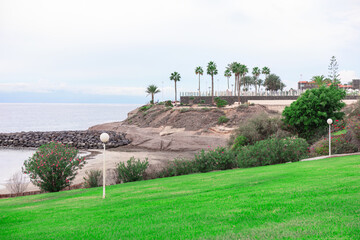 Fanabe Beach at Costa Adeje in Tenerife , Canary Islands . Beautiful landscape of sea coast with...