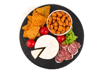 Appetizers table with antipasti snacks, cheese board, isolated on white background. High resolution image.